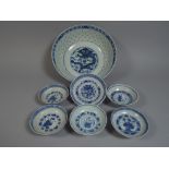 A Collection of Seven Oriental Blue and White Bowls Decorated with Dragons and Flowers Etc.