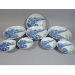 A Set of Four Large and Four Small Shallow Footed Porcelain Bowls Depicting Oriental Scene in Blue