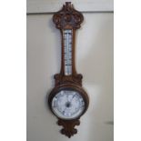 A Late Victorian Carved Oak Aneroid Wheel Barometer by Lennie & Thomson, Dundee.