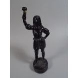 A 19th Century Cast Iron Figure of a 17th Century Page Boy Carrying Raised Torch.