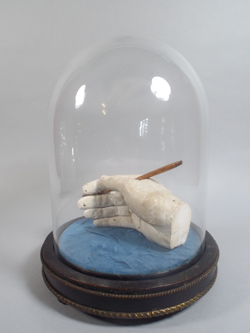 A Plaster Cast of an Artists Hand Holding a Paint Brush,