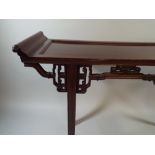 A Good Chinese Padouk Wood Side Table with Carved and Pierced Mouldings and Scroll Ends.