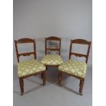 A Set of Six Late Victorian Oak Framed Dining Chairs with Blind Carved Top Rails and Turned Front