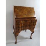 A Pretty Fall Front Walnut Bureau of Serpentine Form.