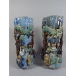 A Pair of Oriental Glazed Stoneware Vases. Decorated with Figures in Relief.