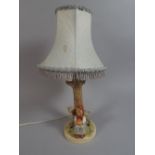 A Goebels Childs Table Lamp in the Form of Seated Girl with Lamb Beside Tree.