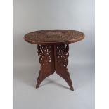 A Small Indian Folding Occasional Table with Bone Inlay and Carved Decoration to Top.