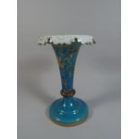 A Bohemian Blue Glass Trumpet Shaped Vase Decorated in Gilt with Floral Silhouettes.