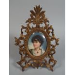 A Continental Painted Porcelain Plaque Depicting Child with Earring and Necklace in Gilt Metal