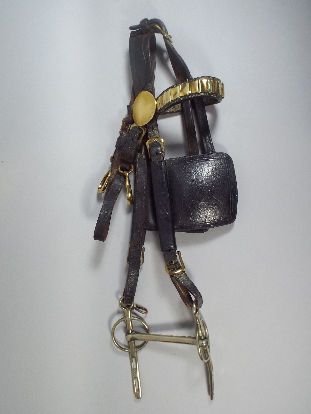 A Victorian Brass Mounted Leather Heavy Horse Bridle with Bit.