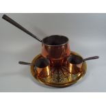 A Large 19th Century Copper Saucepan with Iron Handle, Two Smaller Examples and A Brass Tray.