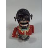 A Reproduction Alloy Jolly Nigger Novelty Bank.