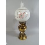 A Brass Table Lamp in The Form of A Victorian Oil Lamp.