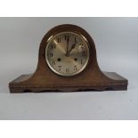An Oak Mantle Clock.