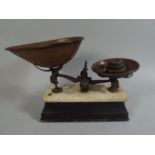 A Set of Kitchen Scales and Weights on Wooden and Marble Plinth.