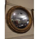 A Circular Gilt Framed Convex Mirror.