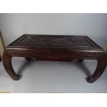 An Oriental Carved Table Decorated with Figures, Pagoda Etc. Having Single Small Drawer.