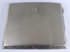 A Gentleman's Solid Silver Cigarette Case, Birmingham hallmark, mm. JG Ltd, dated 1933.