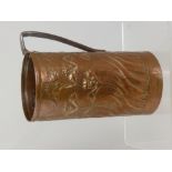 An Arts and Crafts Newlyn style copper jug having floral decoration, est. height 25 cms diameter