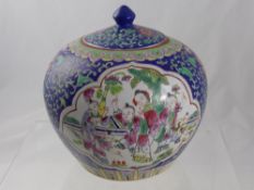 A Chinese Famile Rose Ginger Jar, having blue ground with various characters to outer panels,