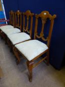 A Set of Four Hardwood Dining Chairs, with decorative back splat's, cabriole style front legs.