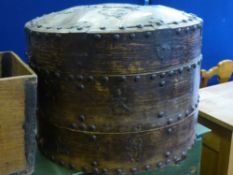 A Chinese Wooden Two Tier Drying Barrel, with metal bands, slightly domed lid with metal plates