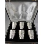 A Set of Six Sterling Silver Beakers, the beakers having floral repousse work with uninscribed