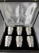 A Set of Six Sterling Silver Beakers, the beakers having floral repousse work with uninscribed