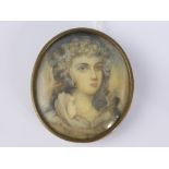 An oval portrait miniature depicting a young lady in Georgian costume, believed to have been painted