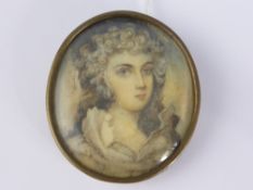 An oval portrait miniature depicting a young lady in Georgian costume, believed to have been painted