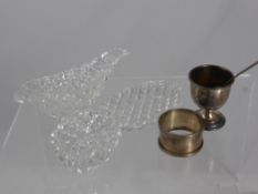 Four miscellaneous items comprising a Victorian cut glass sauce boat and saucer and a salt