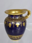 A Sevres 18th Century small gilded Empire period jug, marks to base.