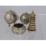 An Indian Silver Cruet Set, comprising of a salt, pepper and mustard with floral repousse work on