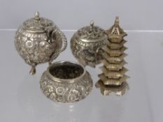 An Indian Silver Cruet Set, comprising of a salt, pepper and mustard with floral repousse work on