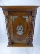 A mahogany medicine cabinet having shelves and a drawer to the interior, the door having Art Nouveau