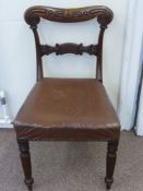 A Rosewood Regency Dining Chair, on reeded legs with decorative bar back.