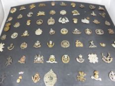 A Carded Display of Sixty Original Military Cap Badges, all in use by the British Army on the