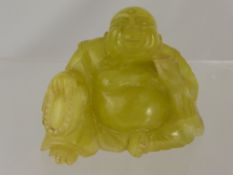 A Chinese Vintage Yellow Stone Carved Figure of a seated Buddha.  9 x 7 cms.