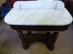 A Victorian Duchess wash stand having marble top and splash back, est. 88 x 41 x 80 cms.