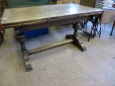 A Vintage Oak Drawer Leaf Dining Table, supported on bulbous columns on splayed feet with single