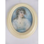 An Oval 19th Century Portrait Miniature, depicting a young lady, est 7 x 5.5 cms, presented in a