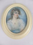 An Oval 19th Century Portrait Miniature, depicting a young lady, est 7 x 5.5 cms, presented in a