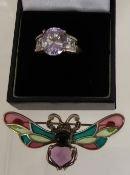 A Lady's Silver and Glass Butterfly Pin Brooch, together with a silver and purple stone ring. (2)