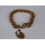 A lady's 9 ct rose gold linked bracelet being hallmarked with safety chain and heart shaped clasp,
