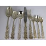 A Silver Metal Indian Flatware Set, comprising eleven forks, twelve cake forks, twelve knives,