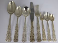 A Silver Metal Indian Flatware Set, comprising eleven forks, twelve cake forks, twelve knives,