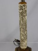 A circa 19th century carved bone scroll depicting various characters with character marks to the