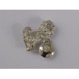 An 18ct White Gold Pin Brooch depicting a Scottie Dog with a diamond set ball, approx 6.1 gms