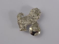 An 18ct White Gold Pin Brooch depicting a Scottie Dog with a diamond set ball, approx 6.1 gms