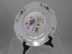 An Antique Famille Rose Plate, hand painted with a floral spray.